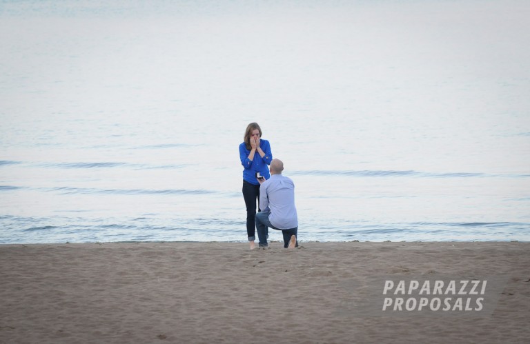 Photo Mark and Theresa’s light house beach paparazzi proposal, Chicago.